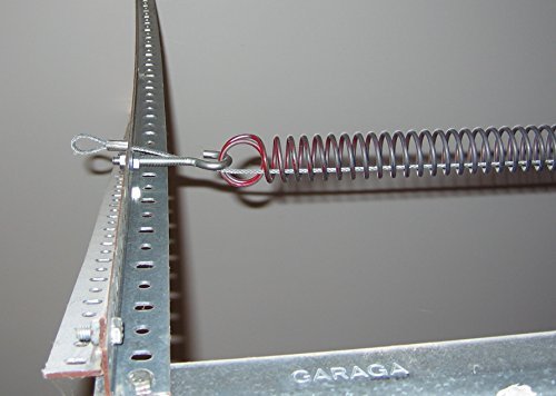 Technician adjusting the tension of garage door extension springs