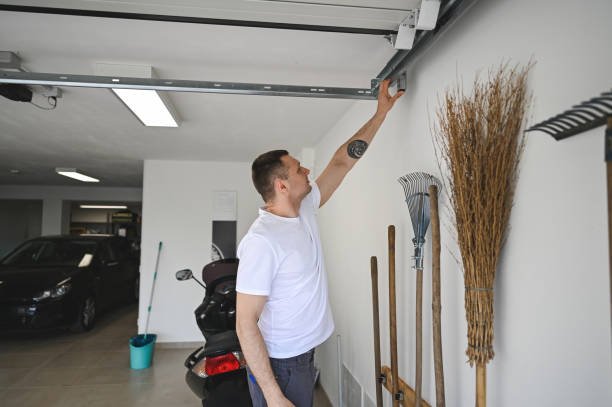 Technician installing a belt-driven garage door opener for quieter operation.