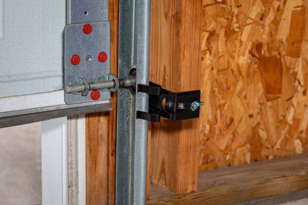 Technician realigning a misaligned garage door track for smooth operation.